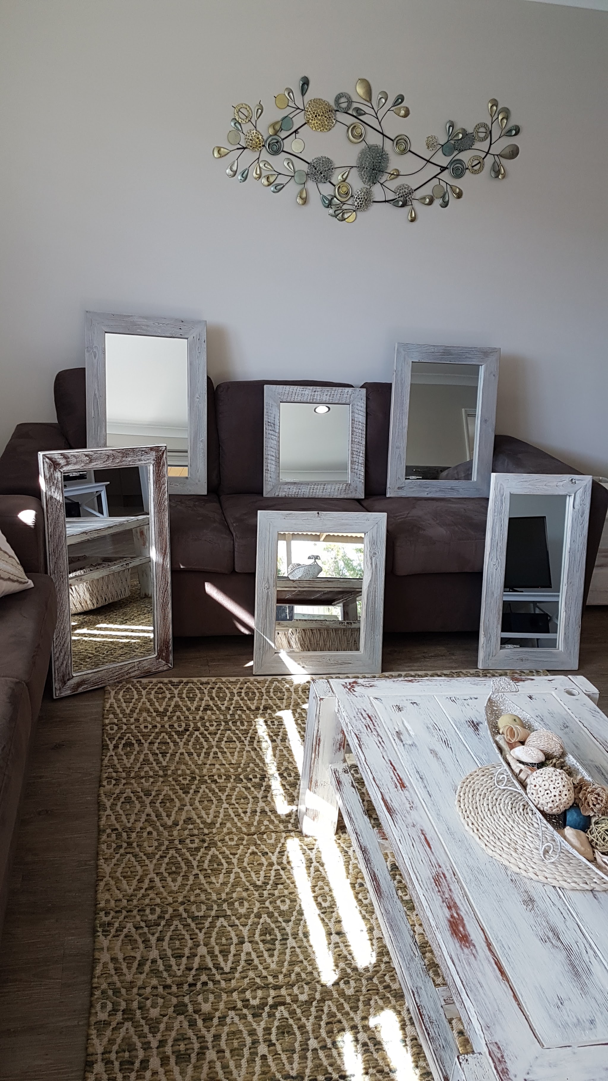 A range of timber framed mirrors in whitewashed and rustic finishes